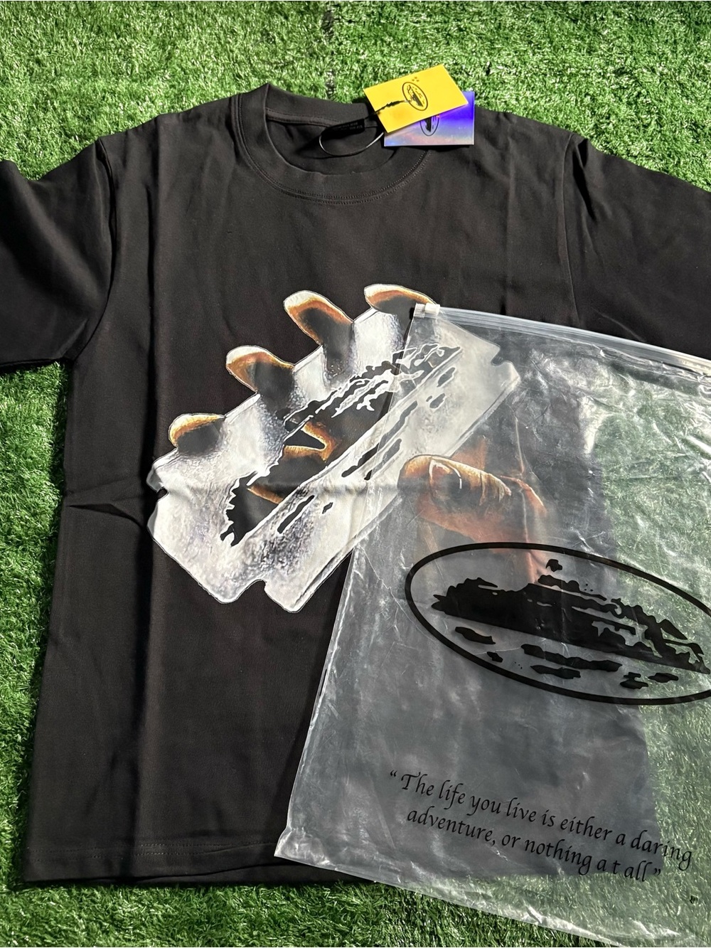 Corteiz Black Graphic Razor Blade T-Shirt with Orange Accent